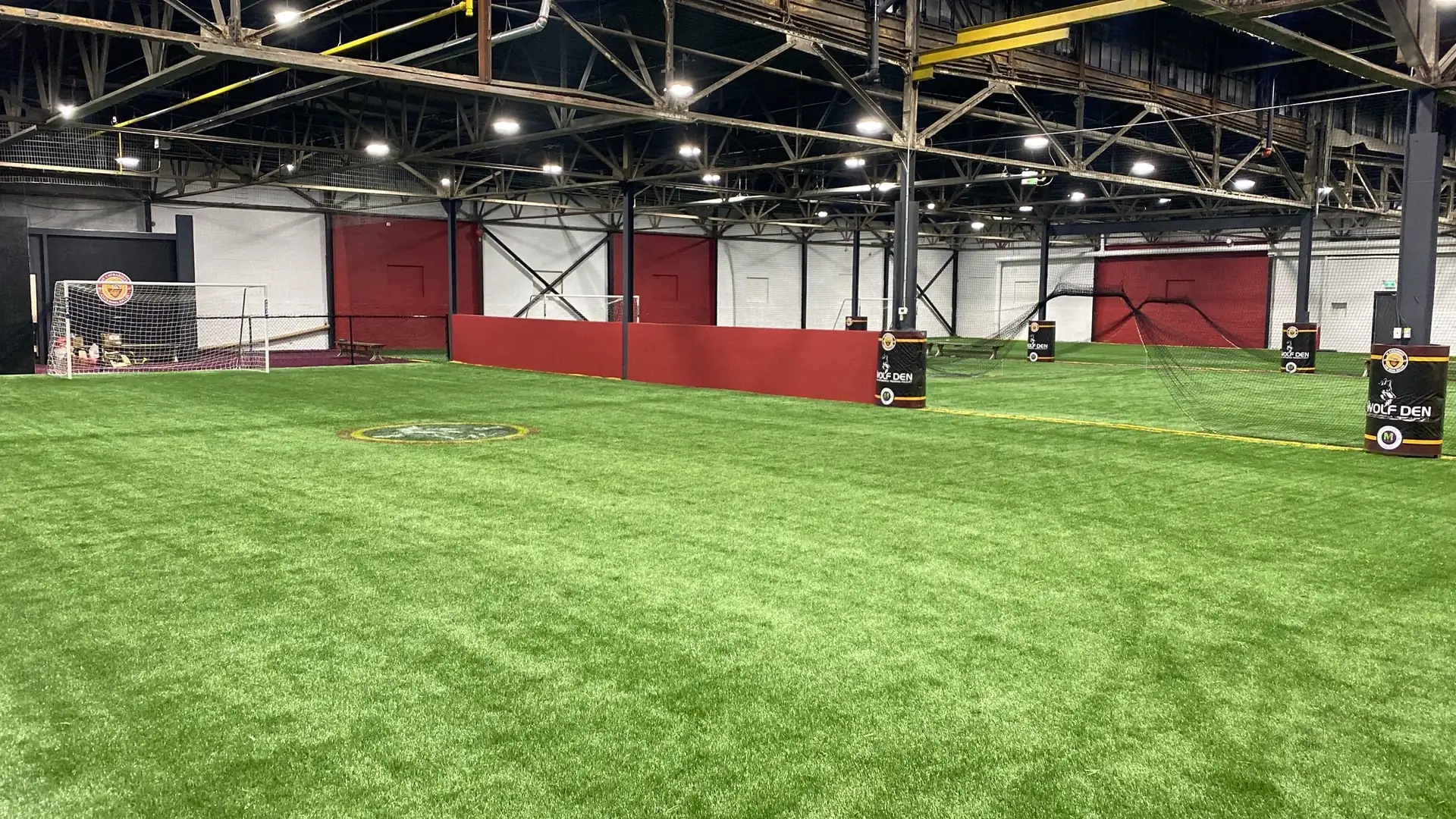 The Wolfden's indoor turf field under the arena lights